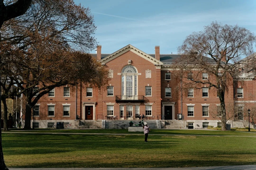 International students walking across a historic American university campus green